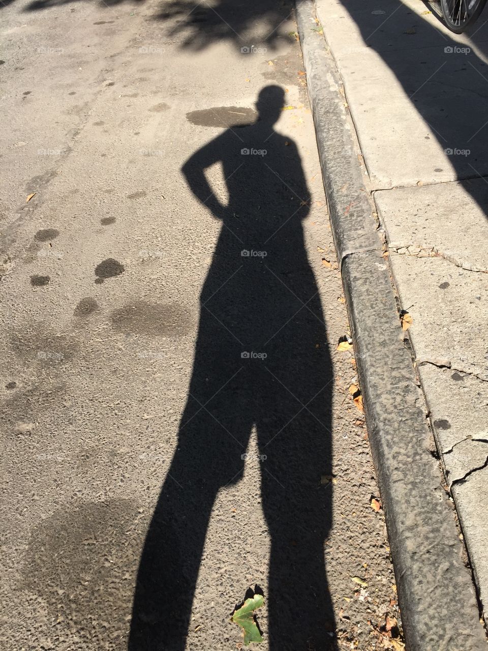 City Street Shadow. I was stretching my calf and realized my stance made me look like Peter Pan so I snapped a photo, as one does. 
