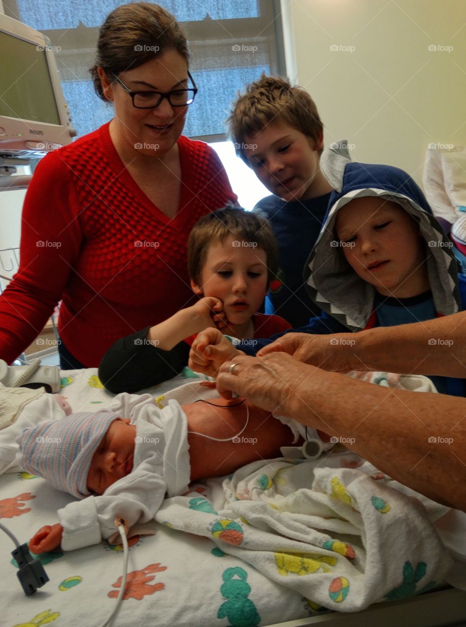 Family With Newborn Infant In The Hospital
