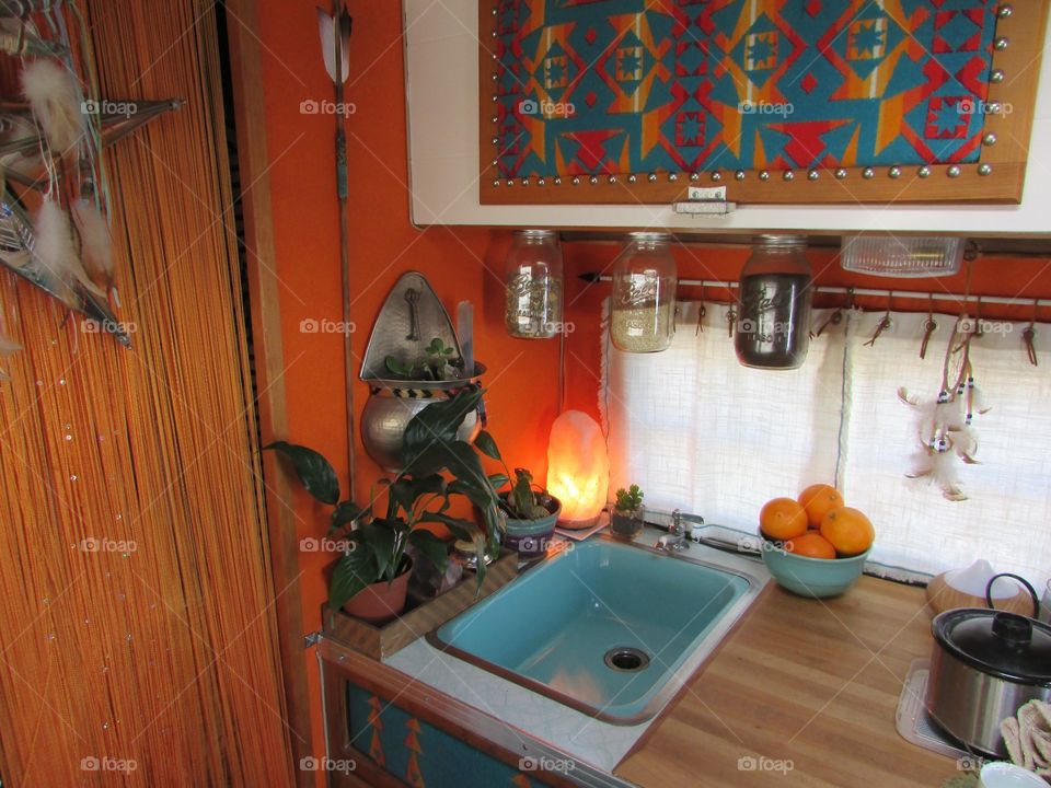 Colorful trailer kitchen interior 
