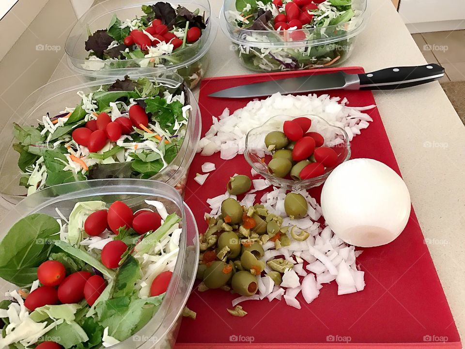 Healthy salads being prepared for the whole family.