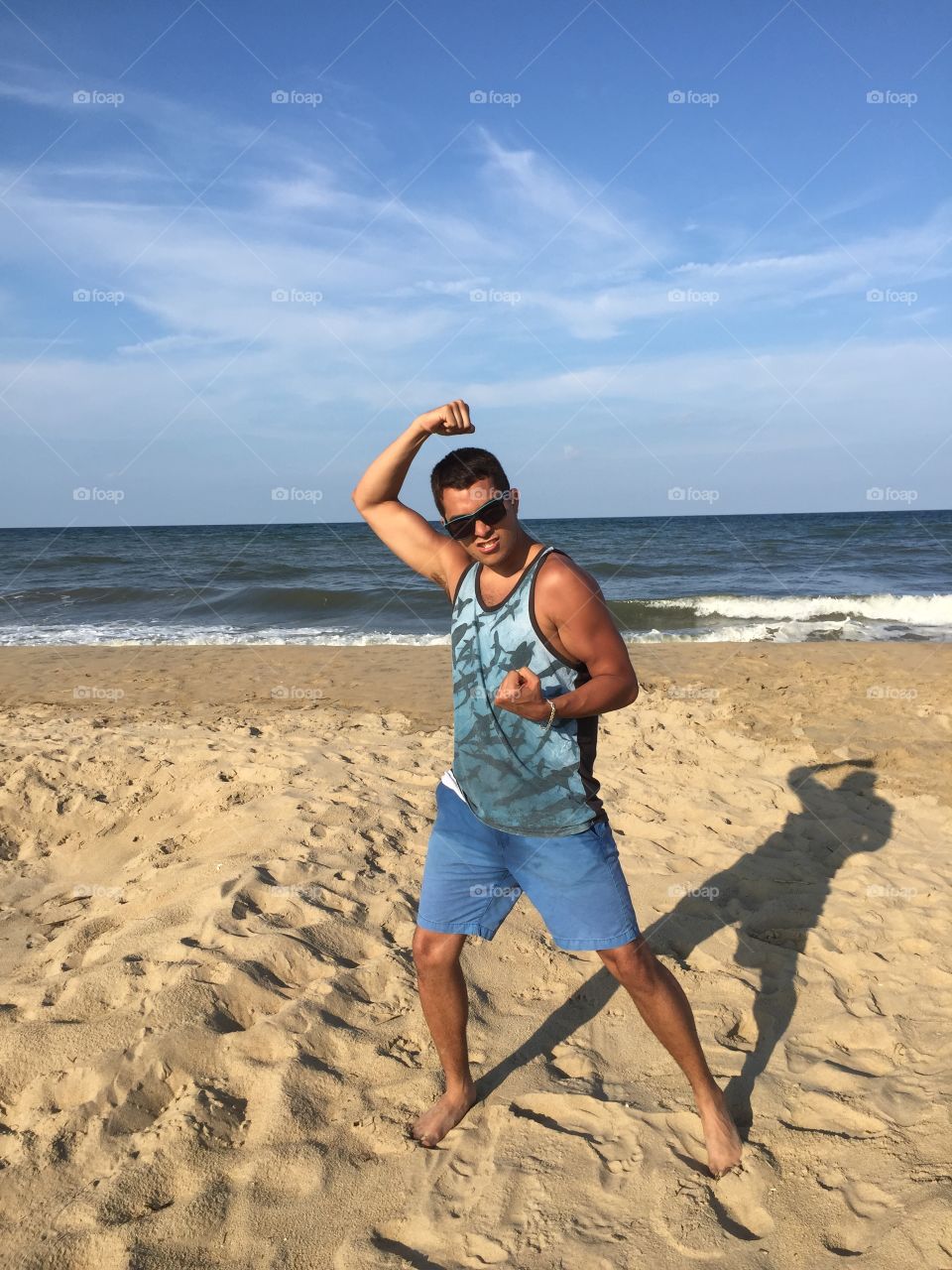 Show me your muscles. Fun at the beach 
