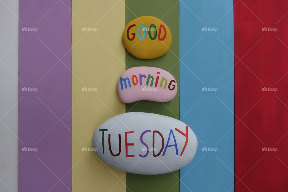Good Morning Tuesday, best beginning greet for a great day with colored stones and rainbow colored wooden board