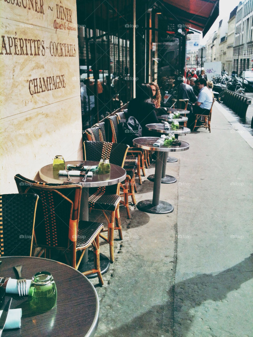 Outdoor seating at a Parisian cafe.
