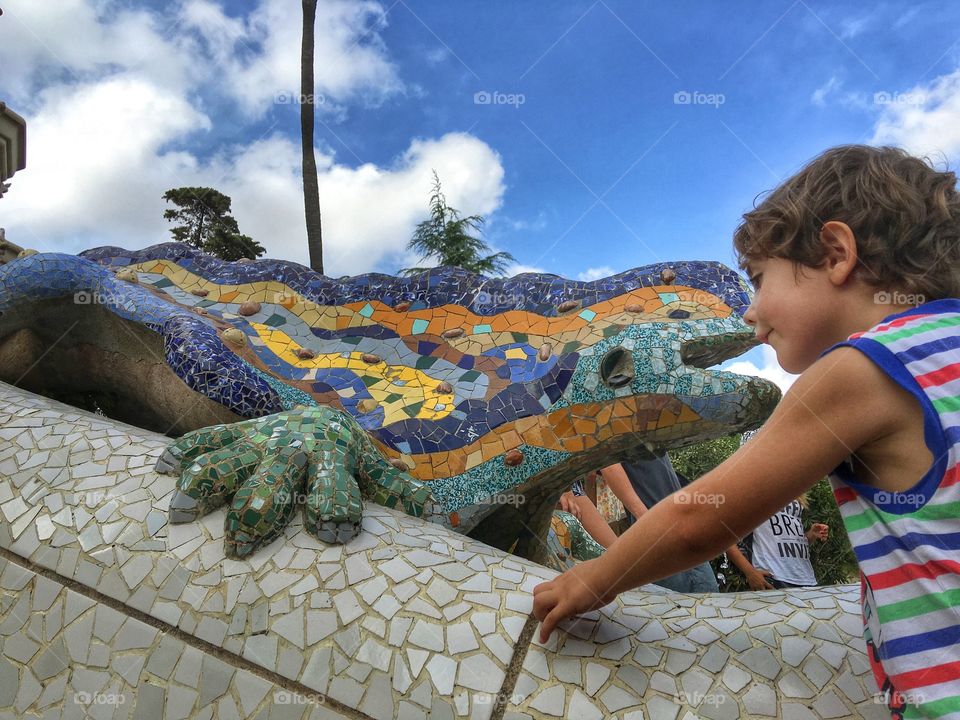 Child playing at gaudi park Barcelona 