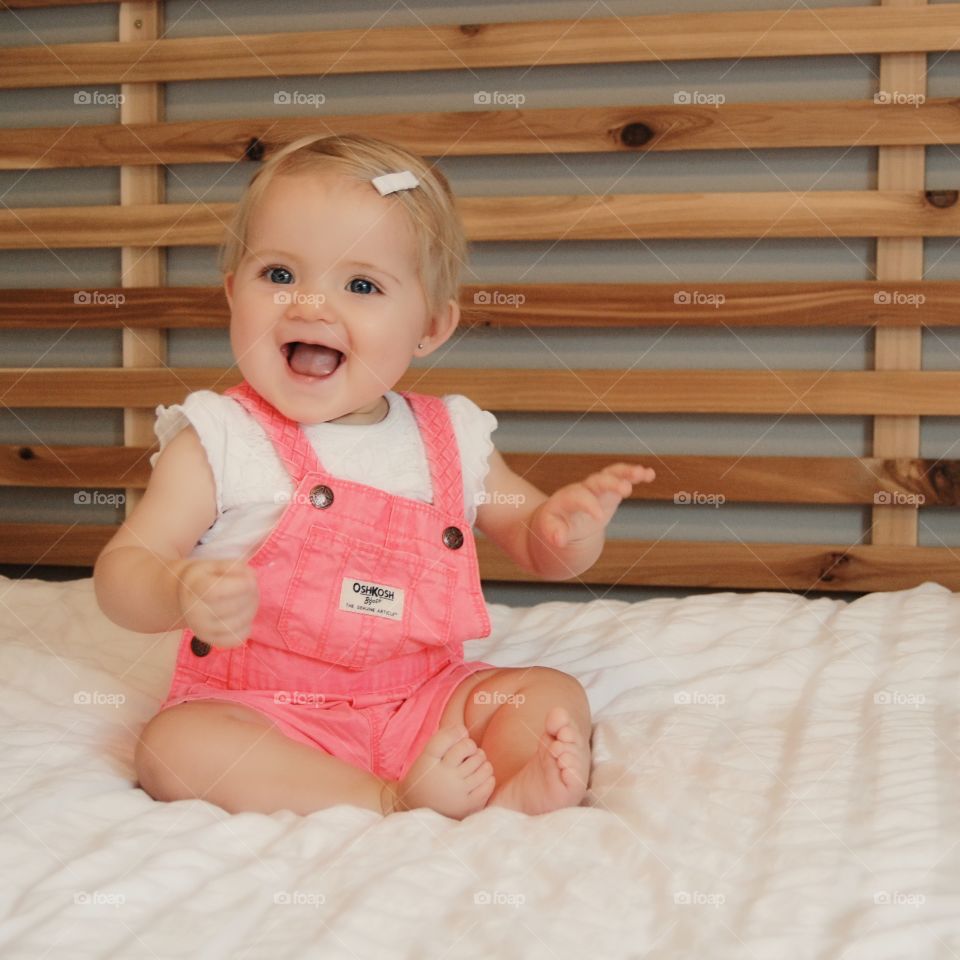happy baby on a bed
