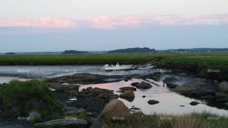 New England Marsh at sunset. watching the shore at sunset