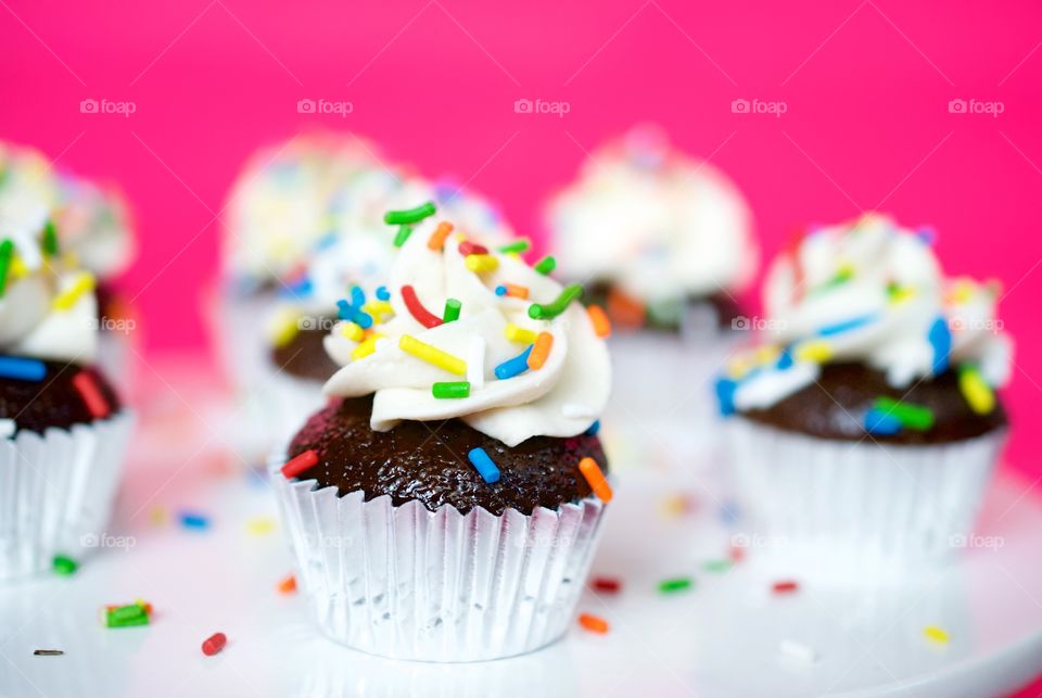 Sprinkled cupcakes on plate