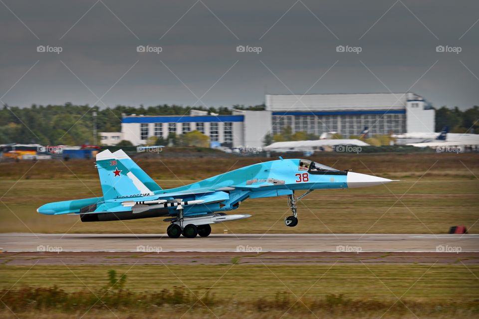 Sukhoi Su-34 Fullback take-off. A fully armed with weapons Russian air force strike fighter Su-34 Fullback
 is taking off from runway.