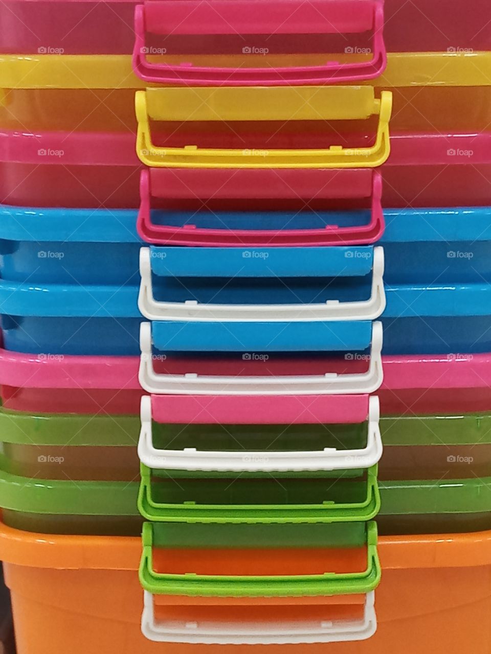 colorful plastic boxes in vertical layers