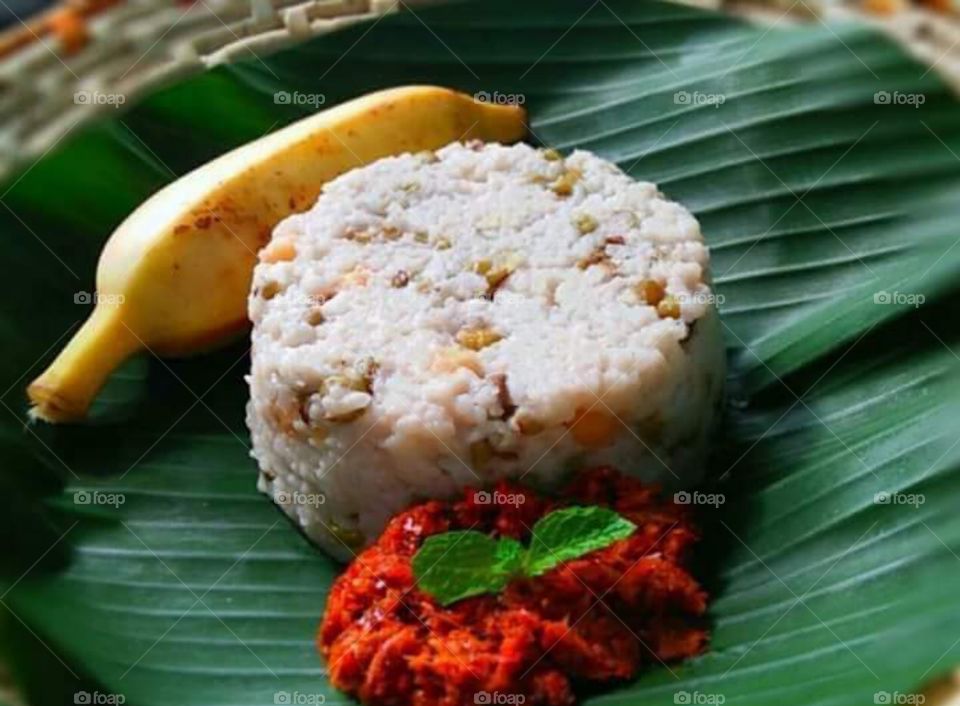 Sri Lankan green gram milk rice with sambal chili paste for breakfast time .