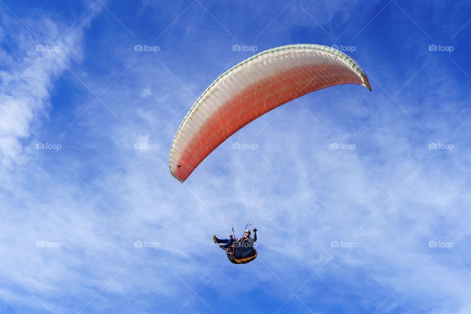 Paraglider in a blue sky