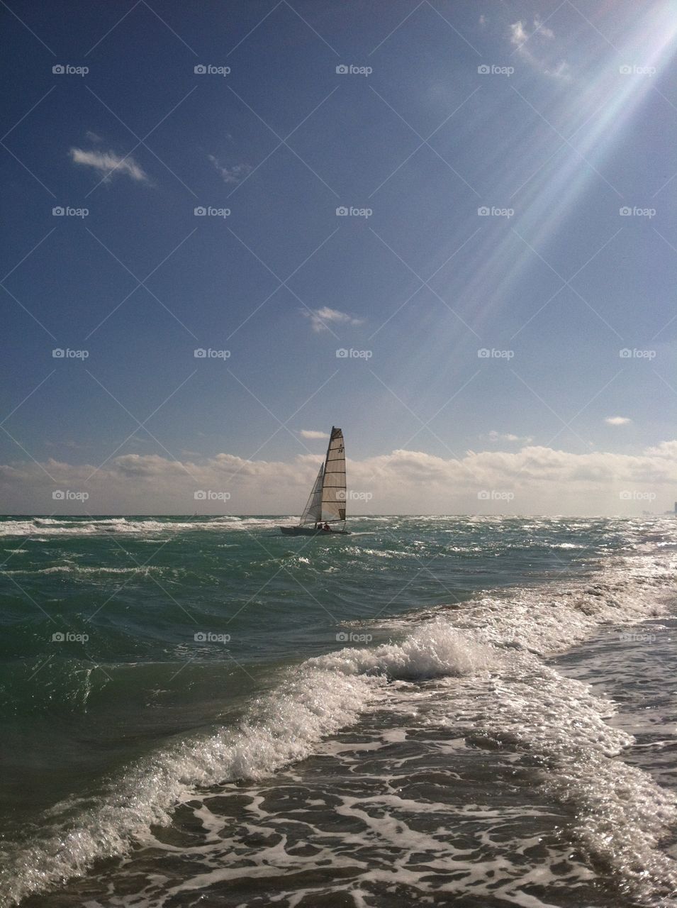 Sailboat Sailing the Ocean on a Sunny Day