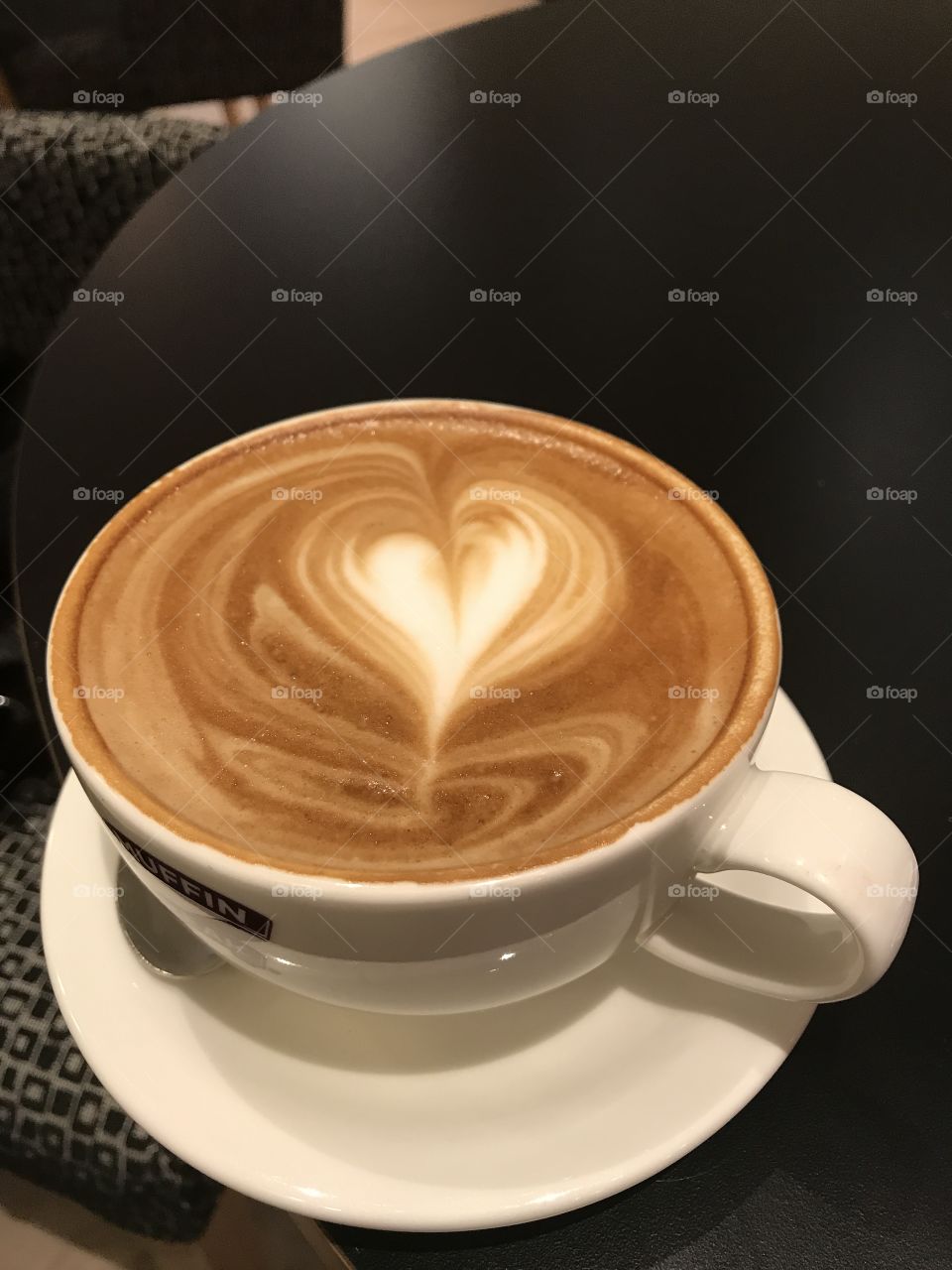 Coffee with a love heart created using the frothy milk