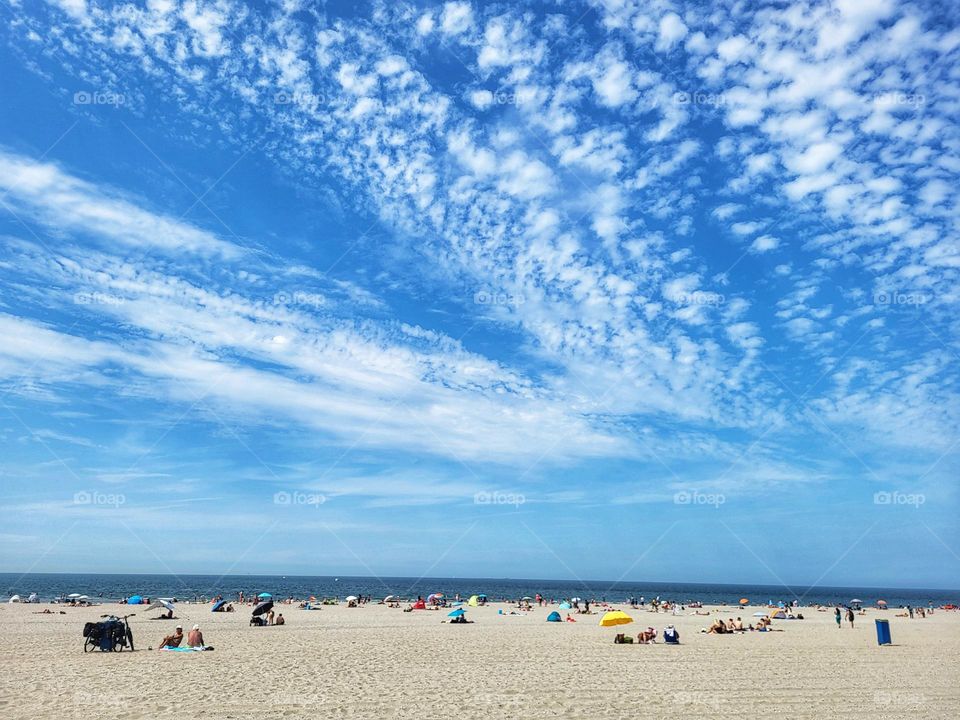 Beautiful clouds in the sky on a summer day on the beach in the Netherlands