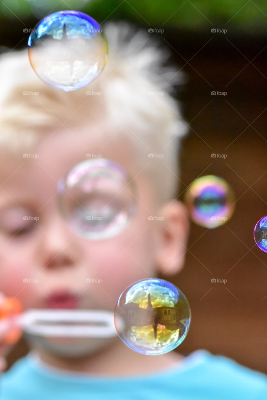 Reflection of bubbles blown by blonde