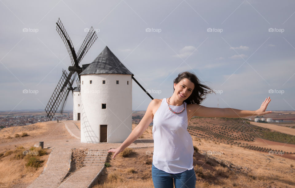Beautiful woman against windmill