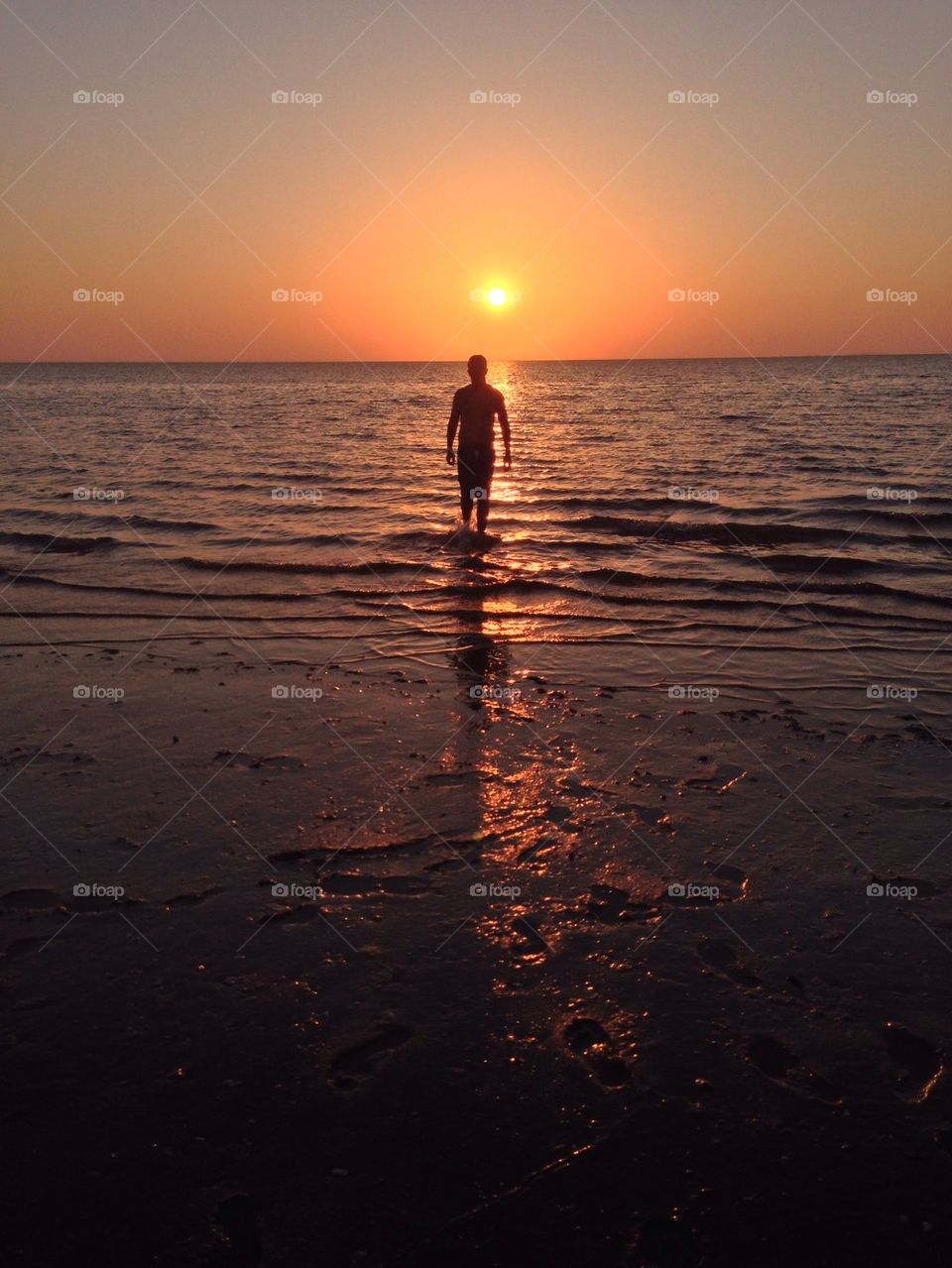 Man walking to the sunset