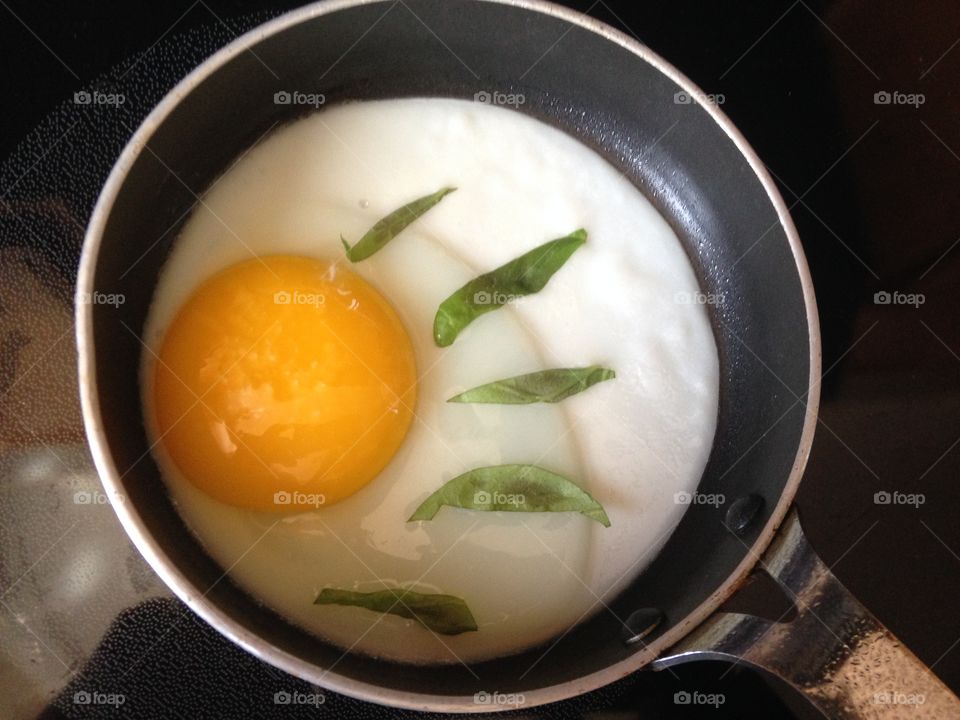 Sunny egg with basil 