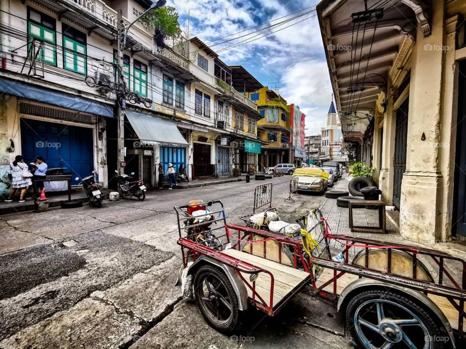 A oddly quiet street scene in the middle of Chinatown in Bangkok, Thailand. This older part of Bangkok is definitely one of my favorite areas in the city.