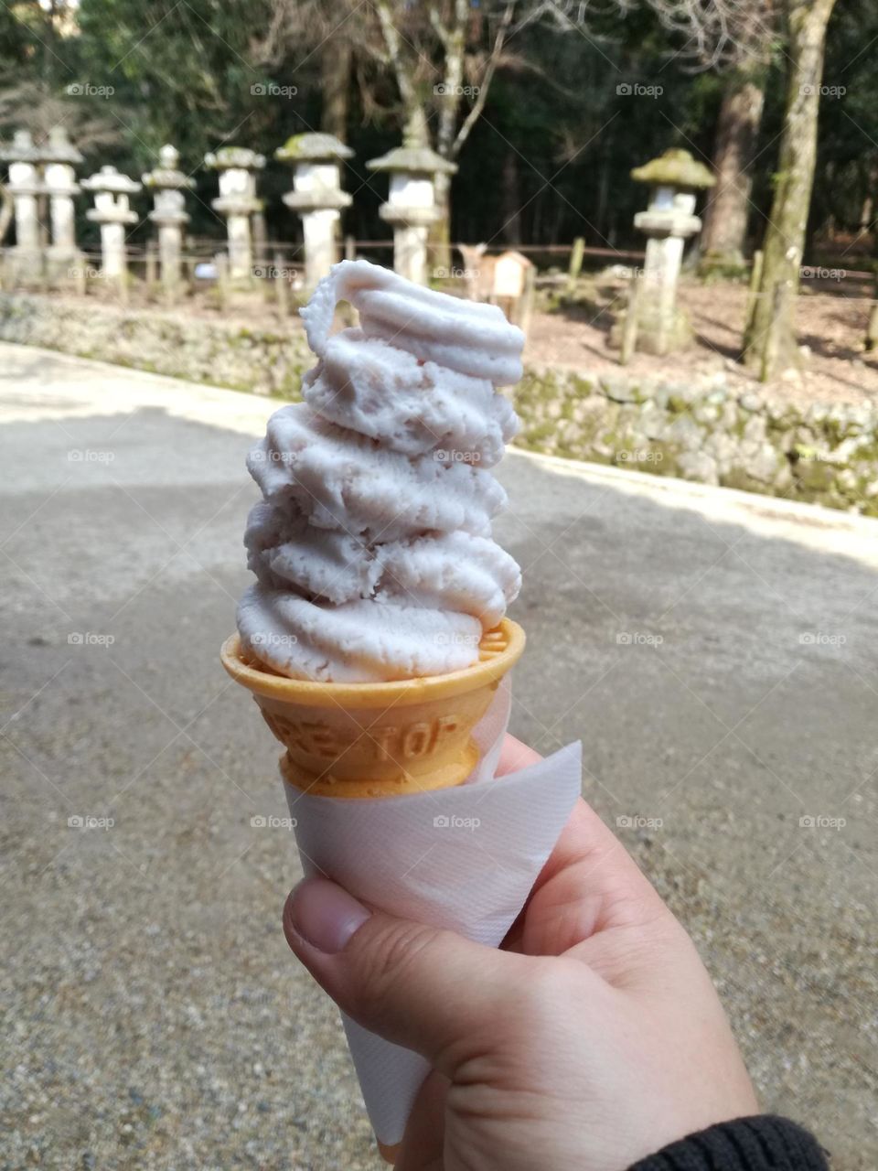 Ice cream in Japan on the backdrop of a temple.