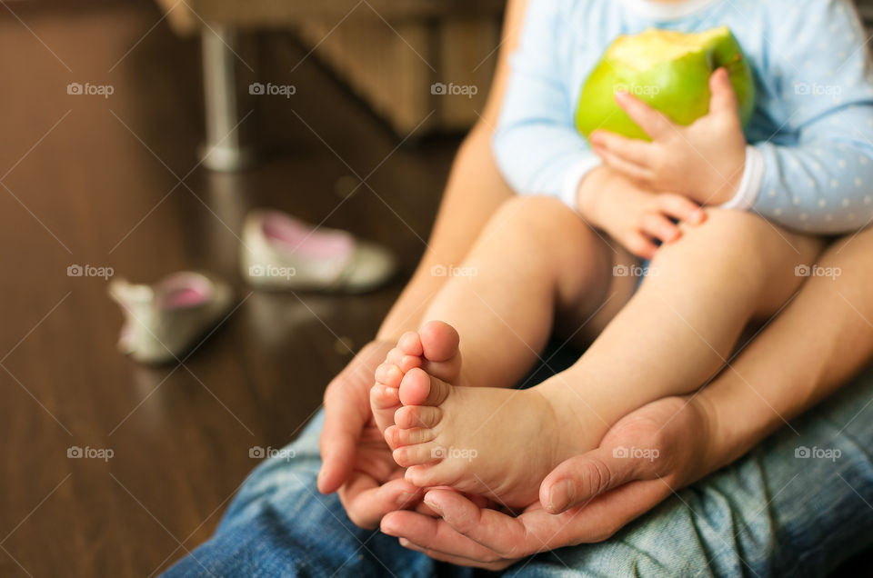 Midsection view of woman with her baby girl