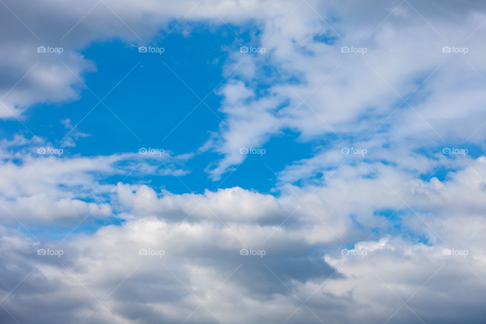 The beauty of the sky with clouds and the sun.