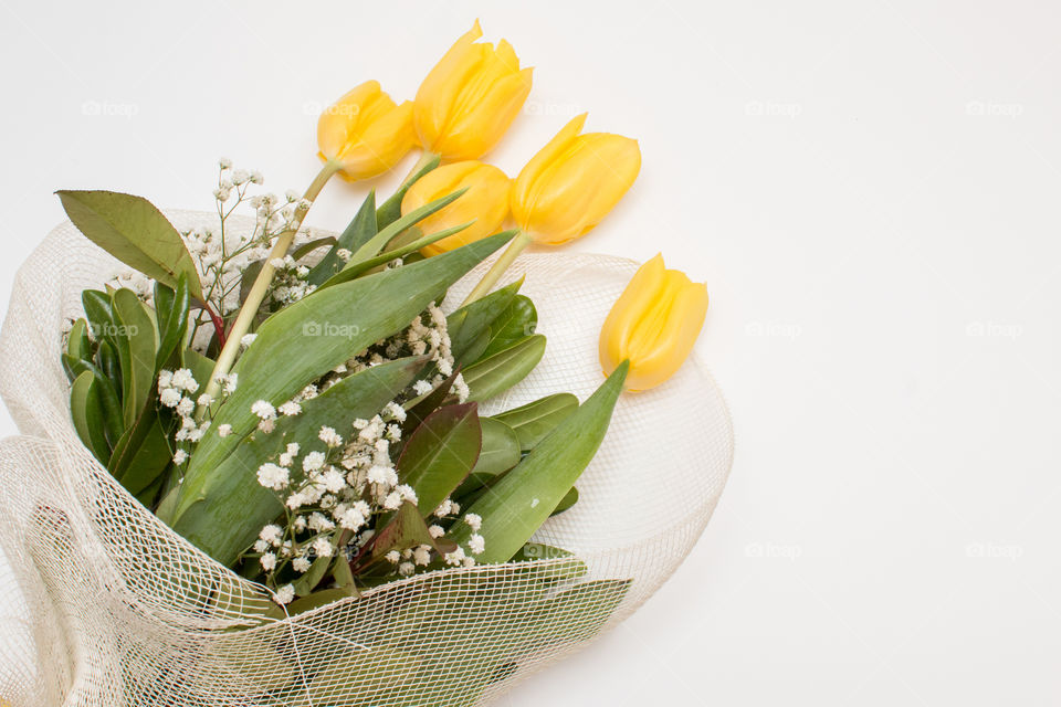 Yellow tulips bouquet whit white backgroung