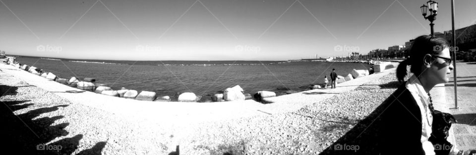 Shadows, sea and face in Bari