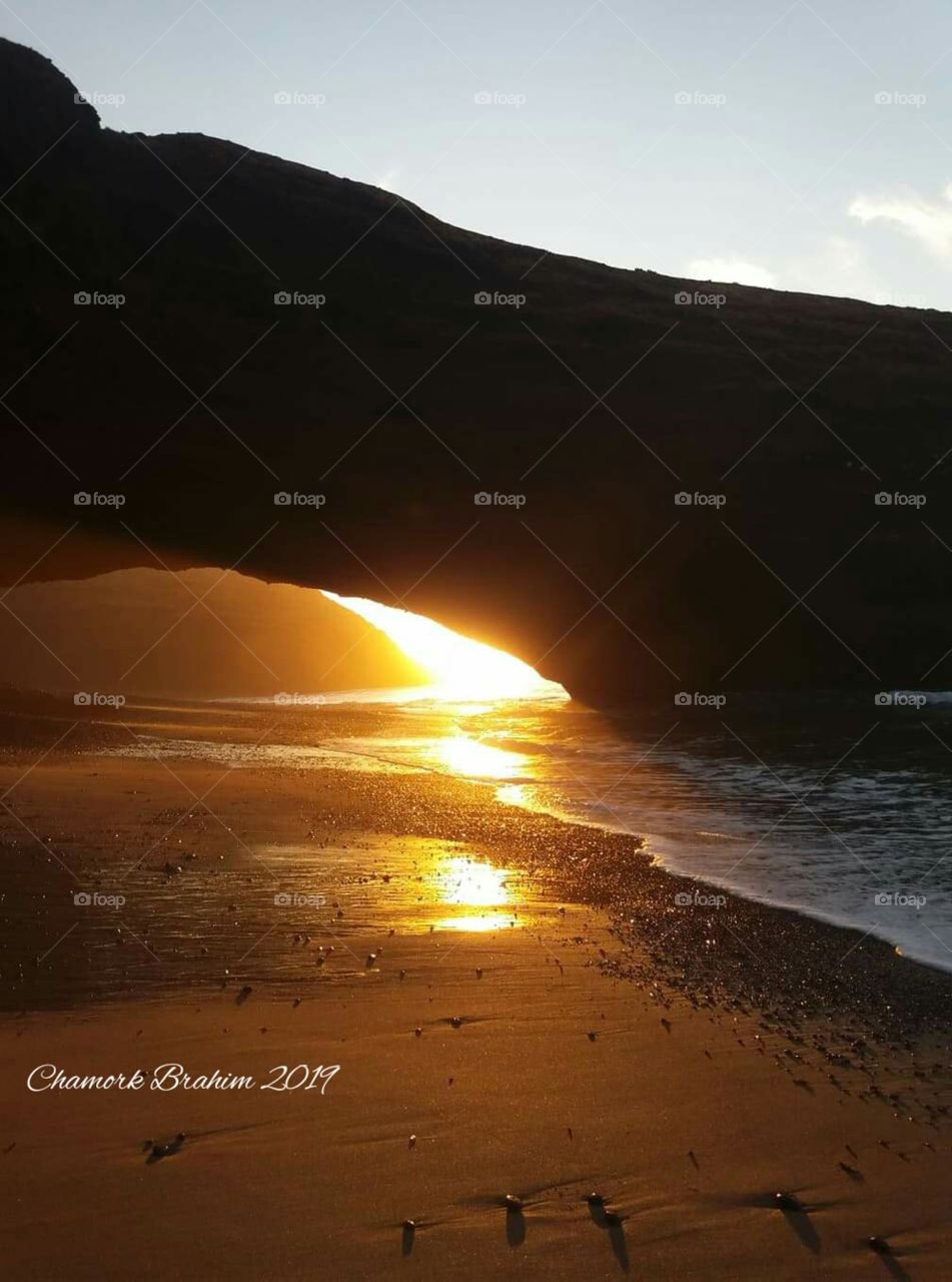 Really it is amazing to watch such a beauty of sunset below an arch.it is so great to capture the moment of sunset disappearing.Wonderful moment