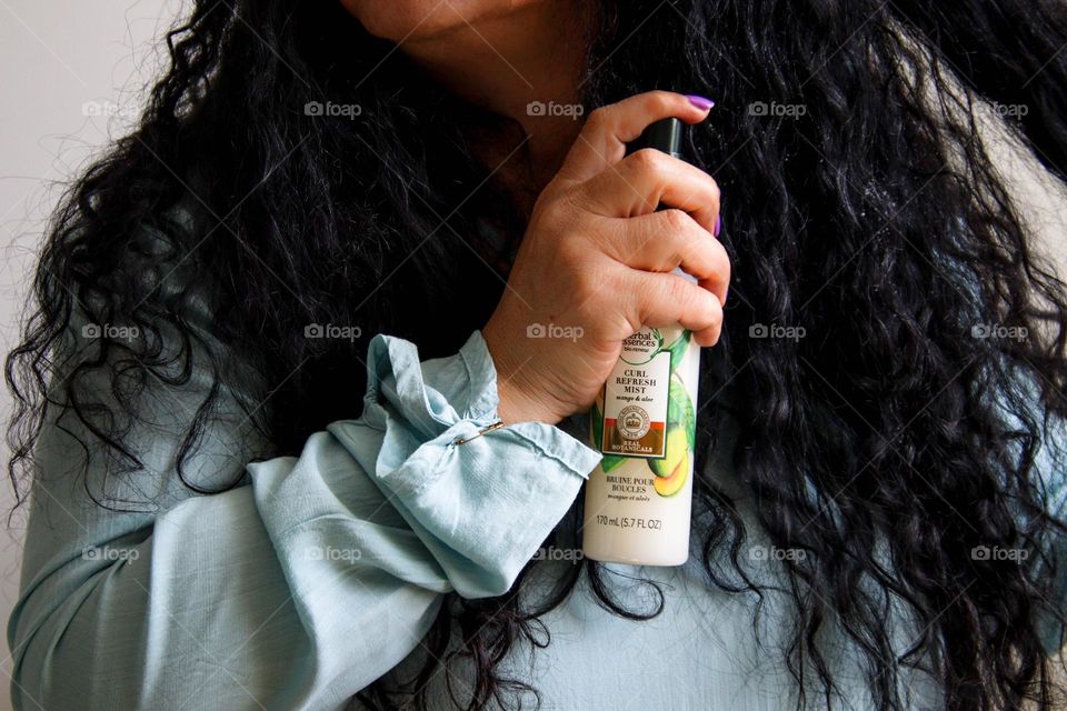 Herbal Essences hair solutions in lady's hand