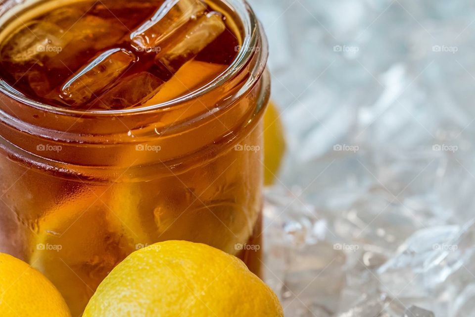 Sweet tea with lemons in ice.
