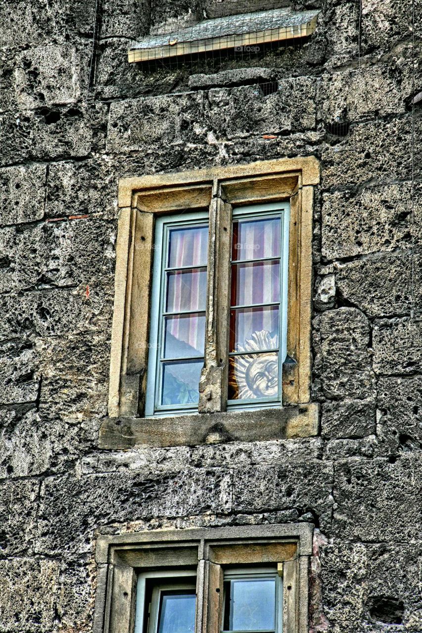 locked in. sun behind a window