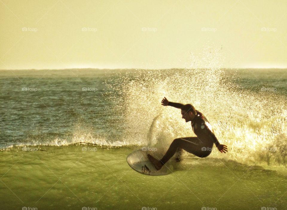 Surfer Challenging A Wave. California Surfing
