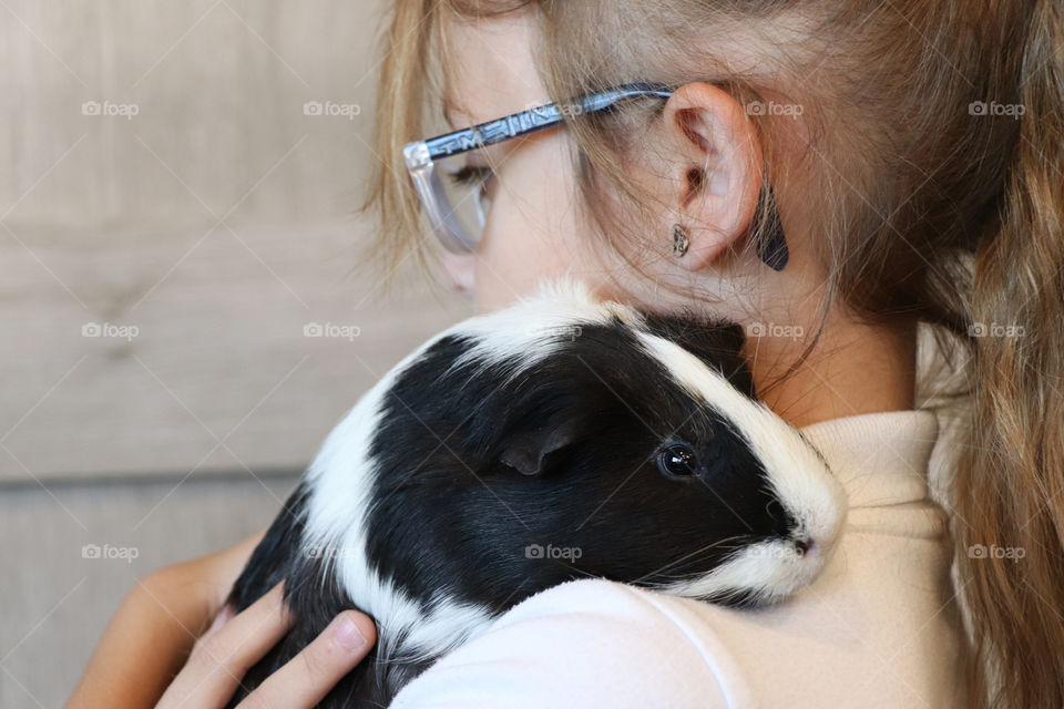 Child and guinea pig