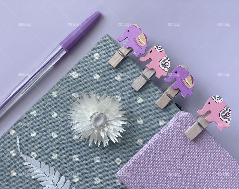 Stationary in pastel shades on light purple background 