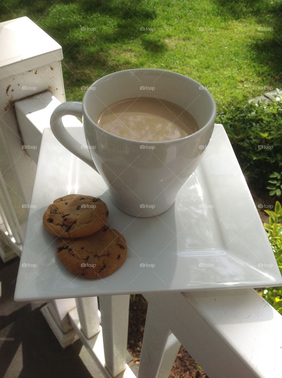 Enjoying a cup of coffee outdoors on a beautiful spring day.