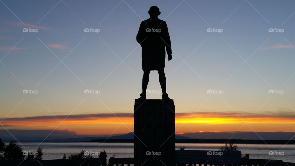 Captain Cook,  Cook Inlet. capt. cook overlooking the cook inlet in Anchorage, Alaska