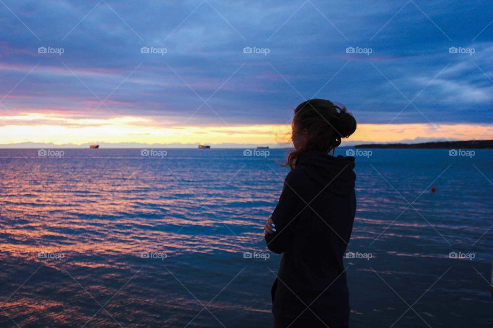 Shadow girl against the sea