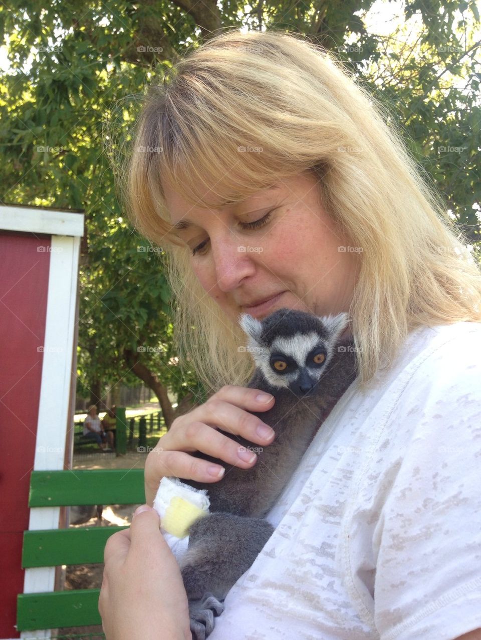 Mom with lemur hugging