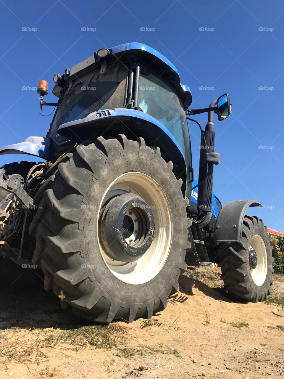 big abandoned blue tractor