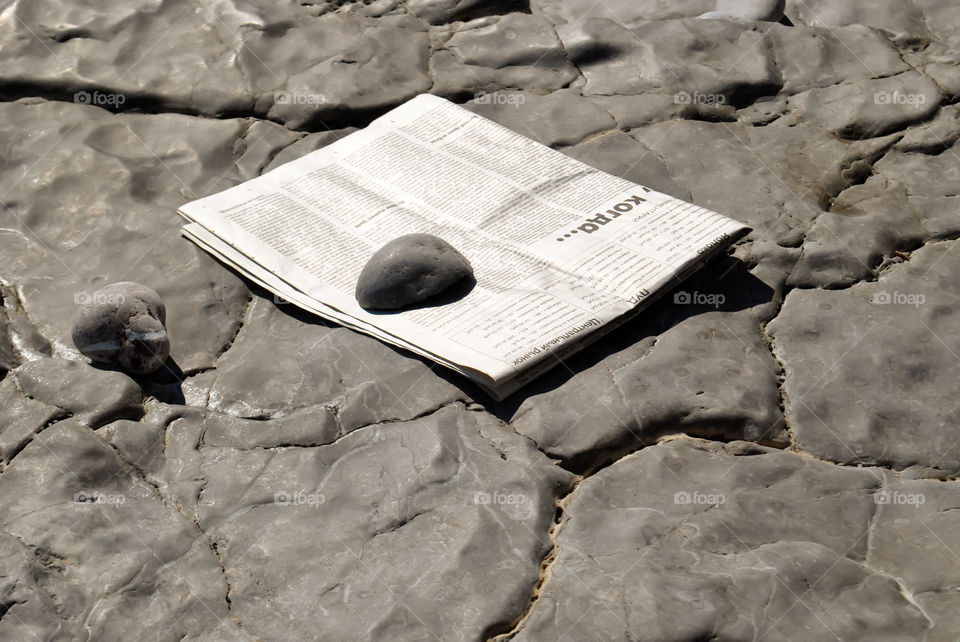Newspaper crushed stone