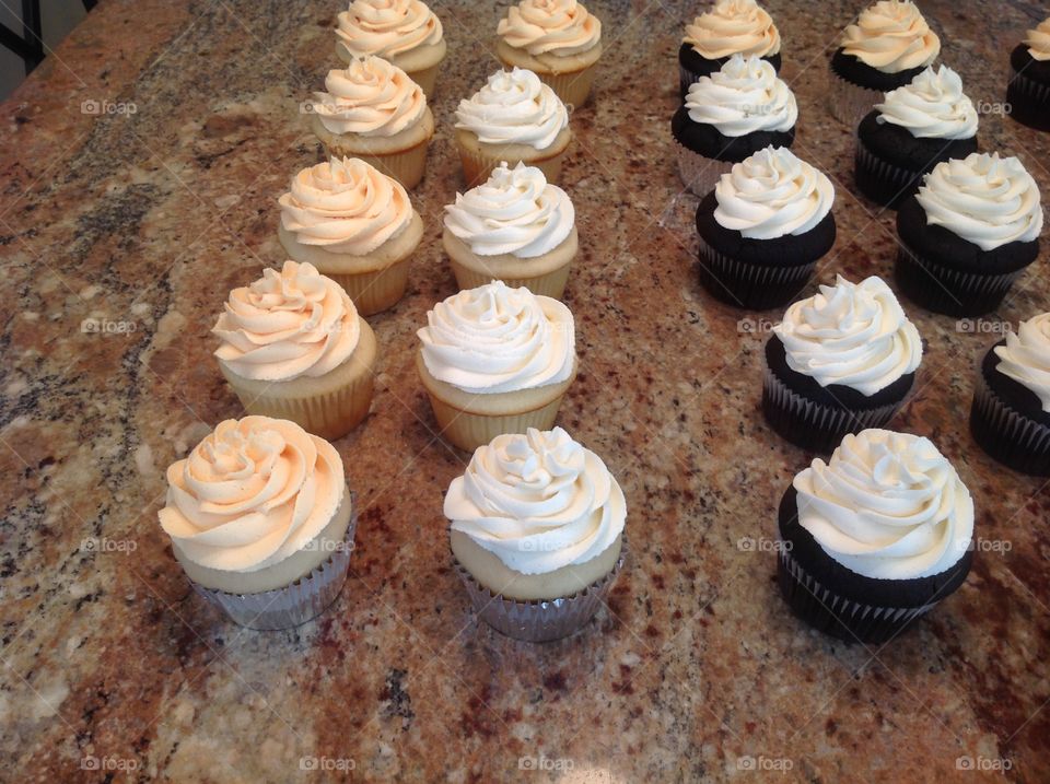 Beautiful cupcakes being prepared for a bridal shower.