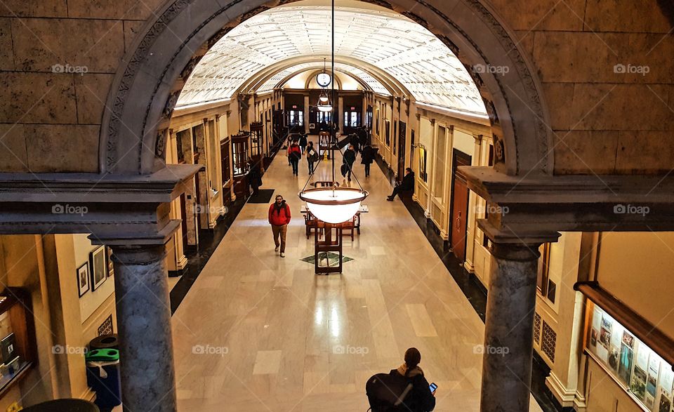 Students walk the halls in the early morning at the Eastman School of Music