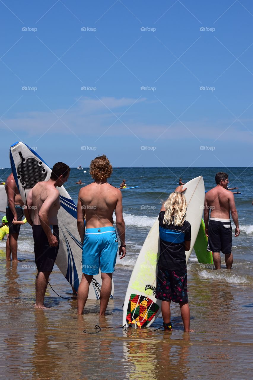 Young Surfers. Surfers of all ages at the beach.