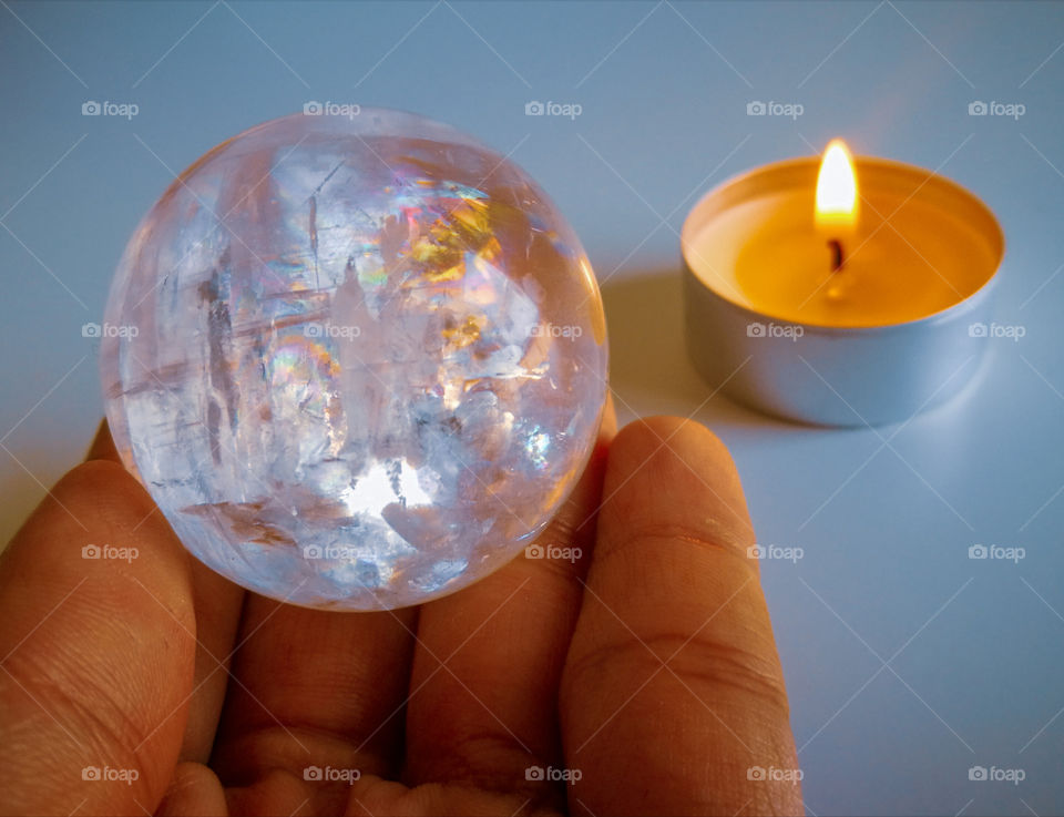 Clear crystal quartz ball with tealight candle