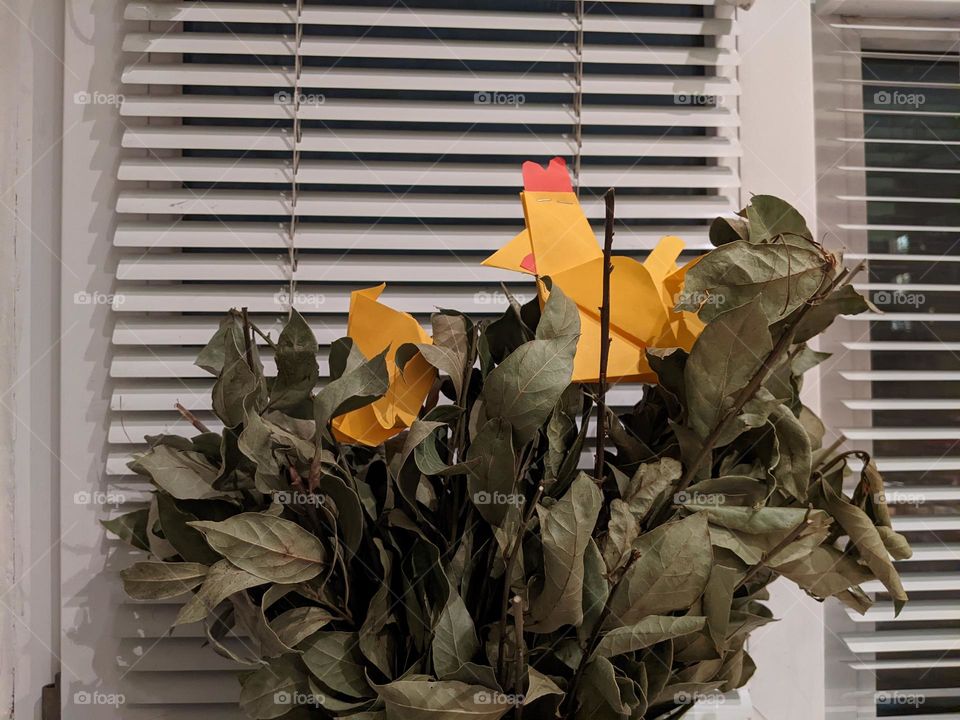 bouquet of dry bay leaves and origami in the form of birds