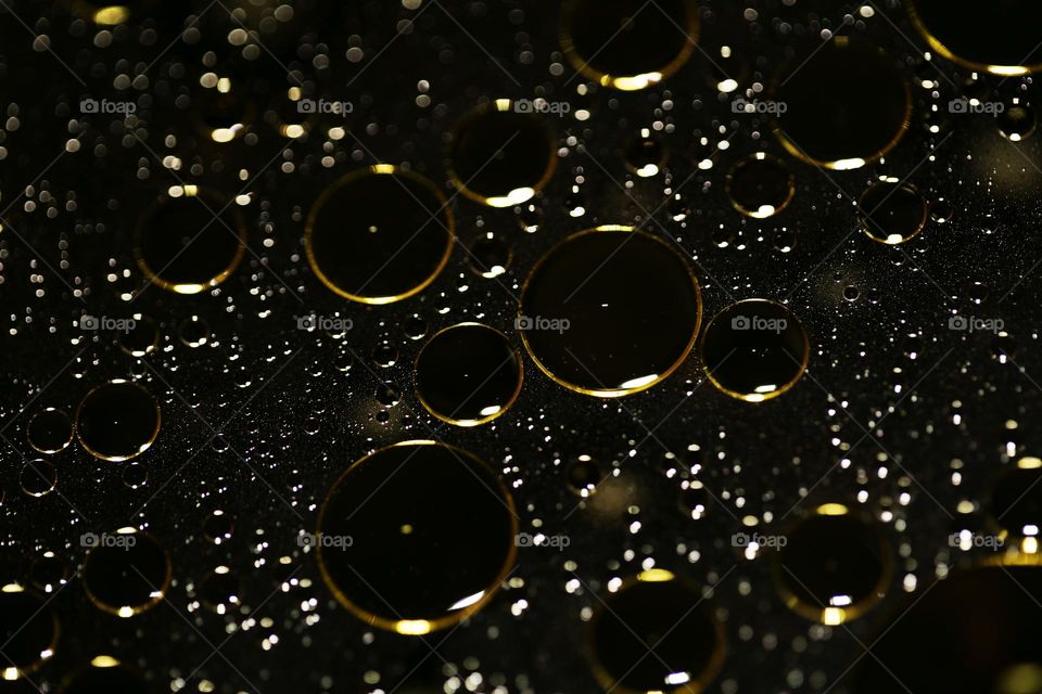 Oil golden bubbles close up background amazing droplets with colours trippy psychedelic minimalist art attack making wonderful view