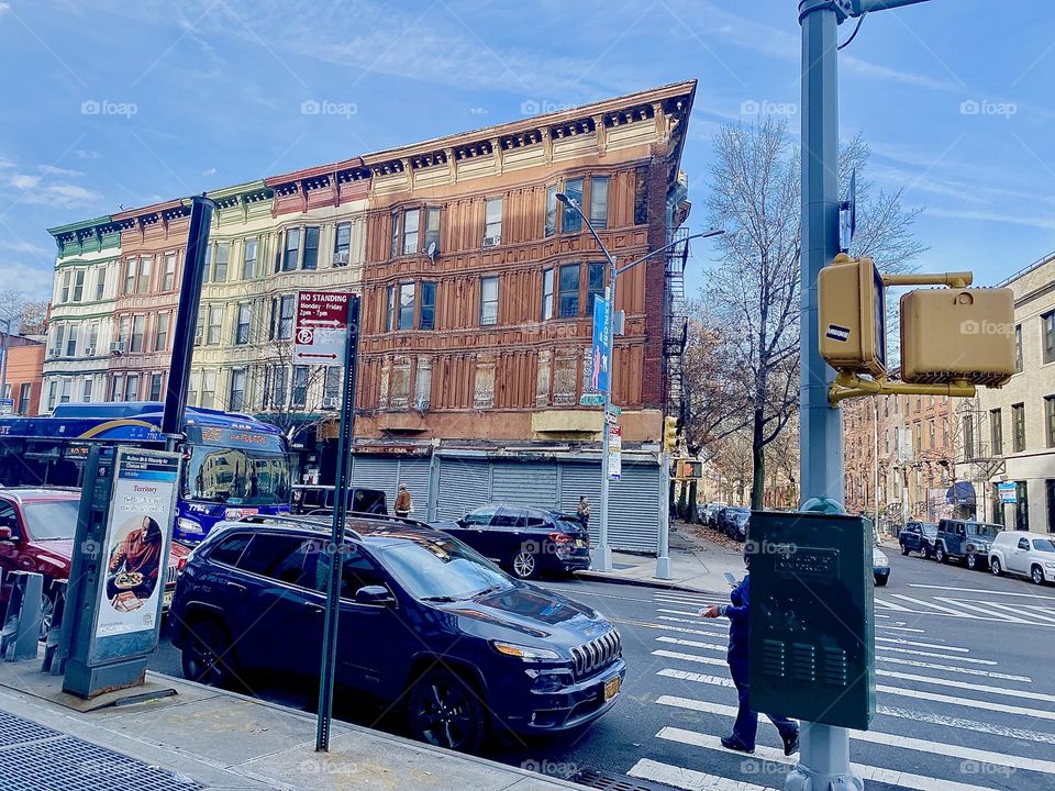 A peculiar looking brownstone in Fort Greene, Bklyn, NY seen from across Fulton Street on a late afternoon in December 2021. Hypnotic Productions