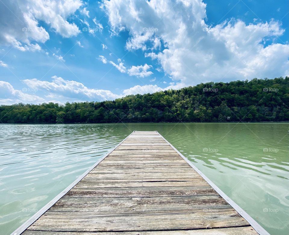 Sitting on a dock on Lake Cumberland surrounded by the Appalachian mountains in Kentucky USA