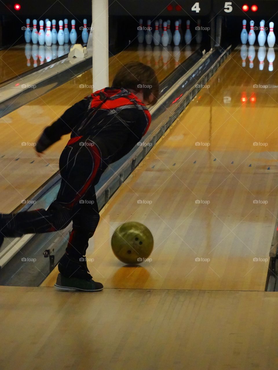 Young Boy Bowling
